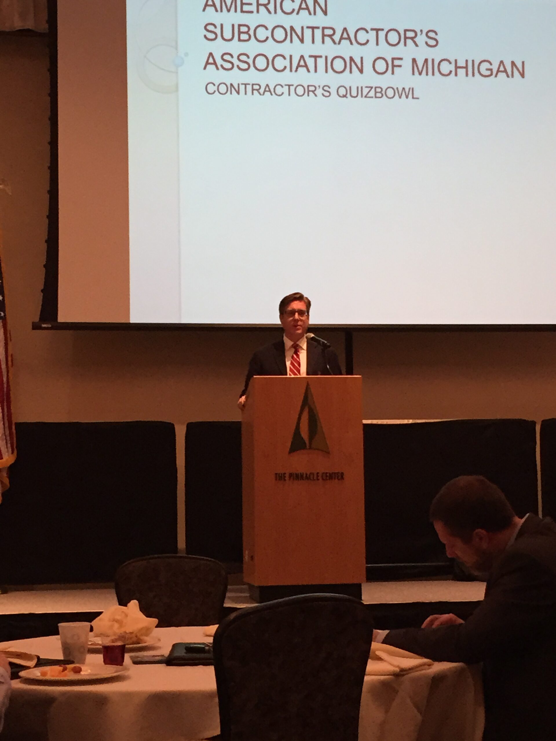 Lawyer Ben Hammond moderating a legal Quiz Bowl event