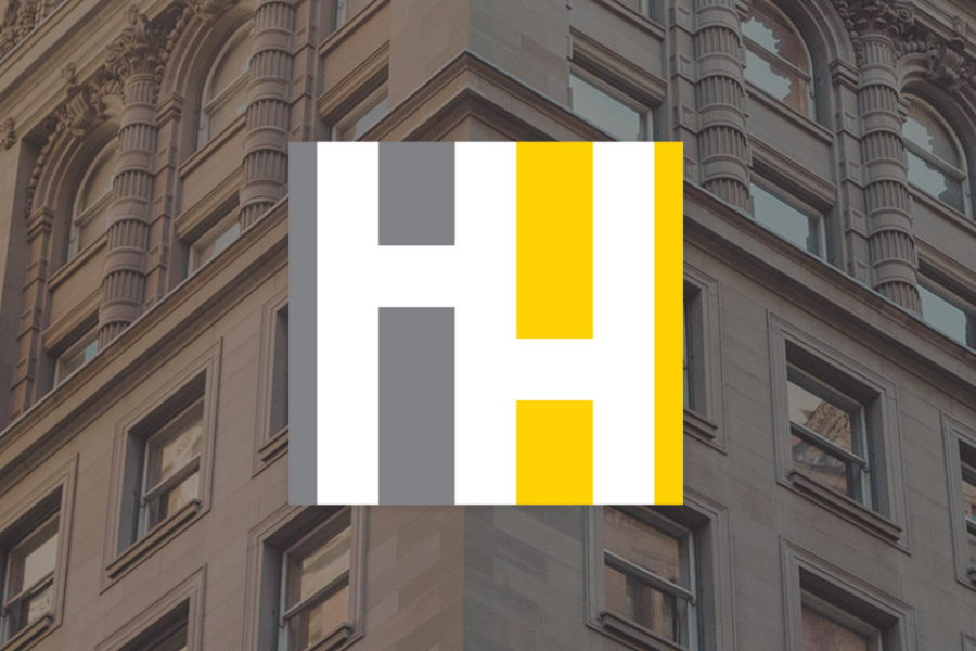 Hilger Hammond icon overlaid on image of the exterior of the firms downtown Grand Rapids office.